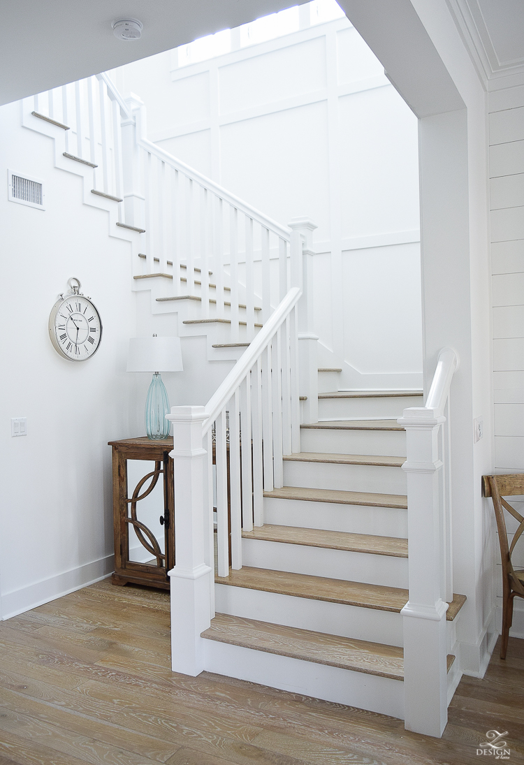 White staircase with grid pattern beach house decor beach house design coastal house design wooden handrail on staircase-1