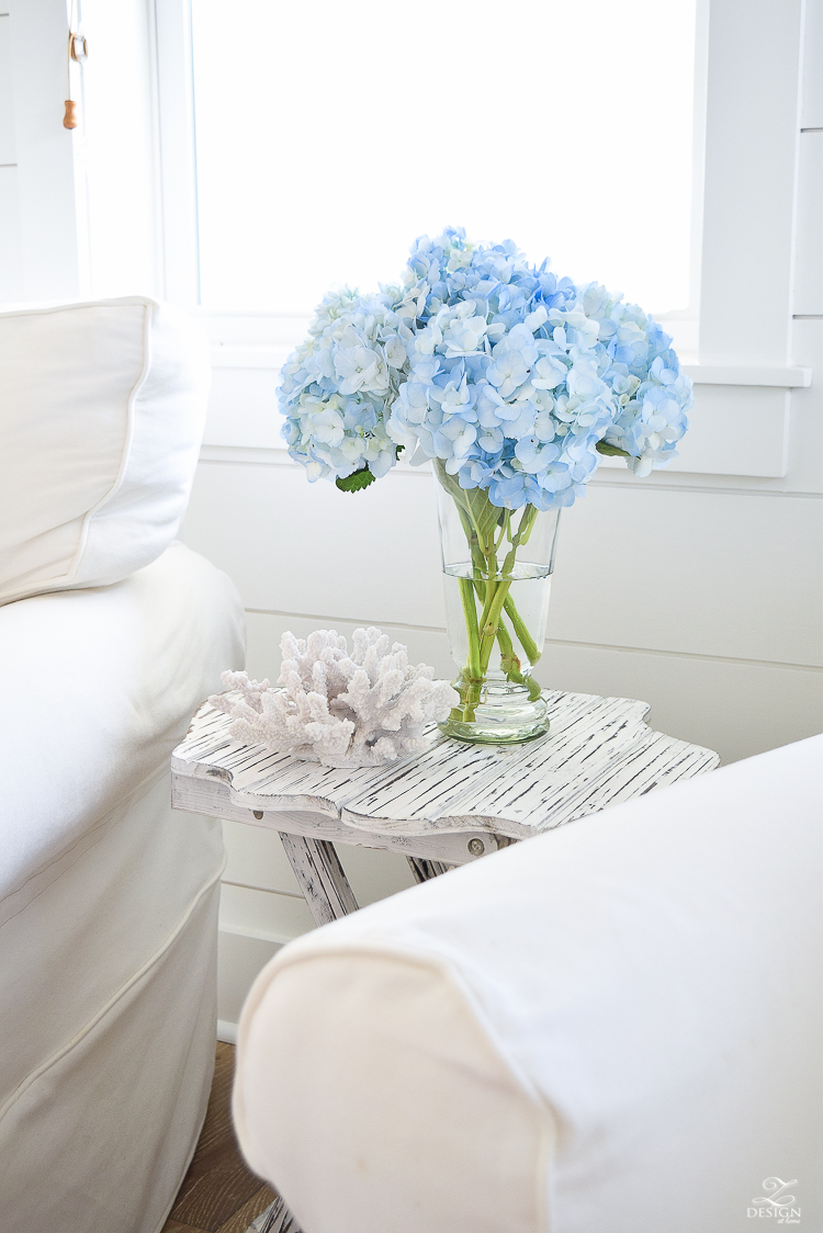 blue hydrangeas beach decor coastal living room design beach house living room decor beachy pillows white slipcovered chairs -1