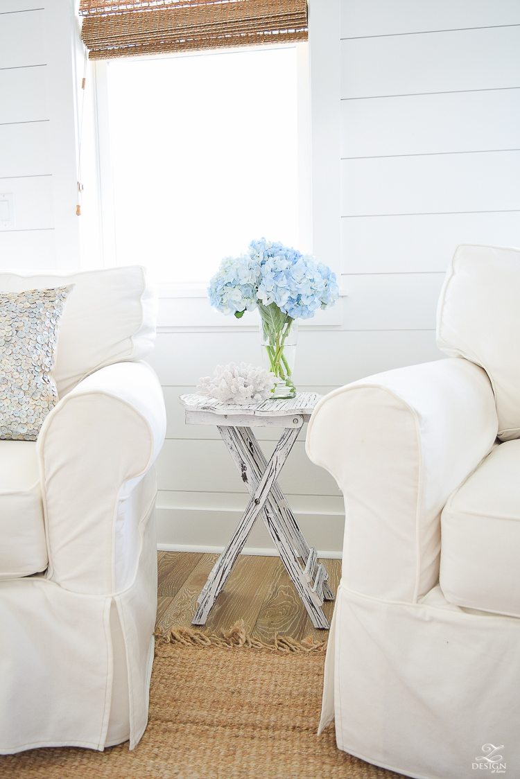 blue hydrangeas beach decor coastal living room design beach house living room decor beachy pillows white slipcovered chairs -2