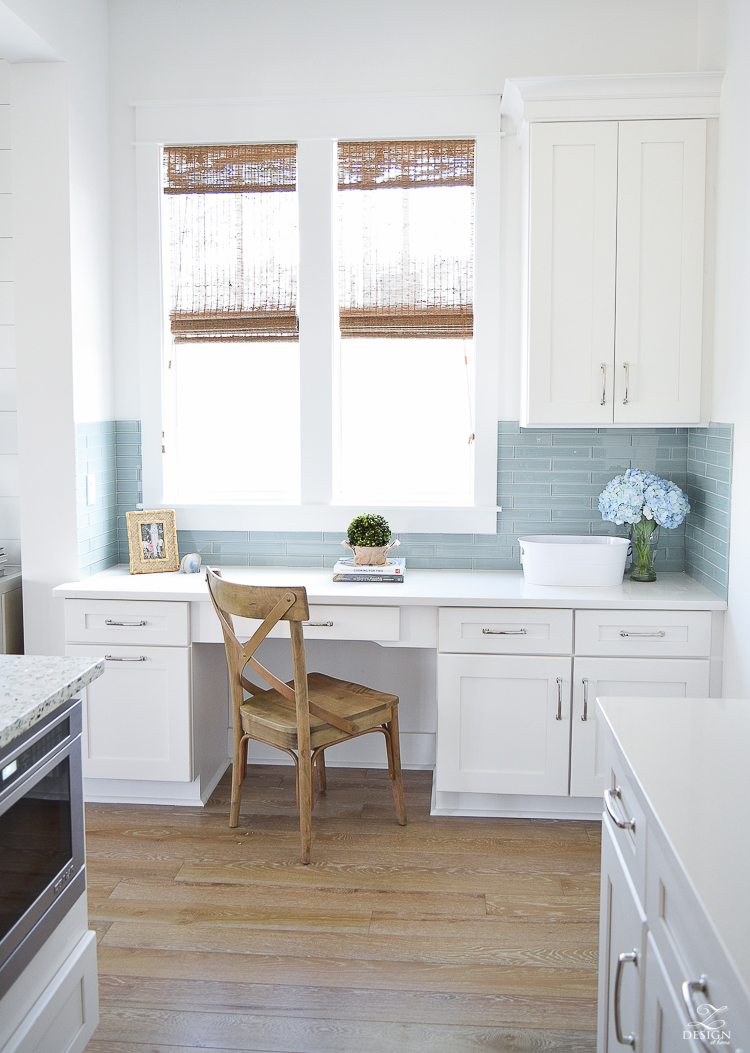 desk area in kitchen white shaker cabinets beach house decor desk in coastal kitchen windows over desk aqua glass tile distressed blonde wood floors-1