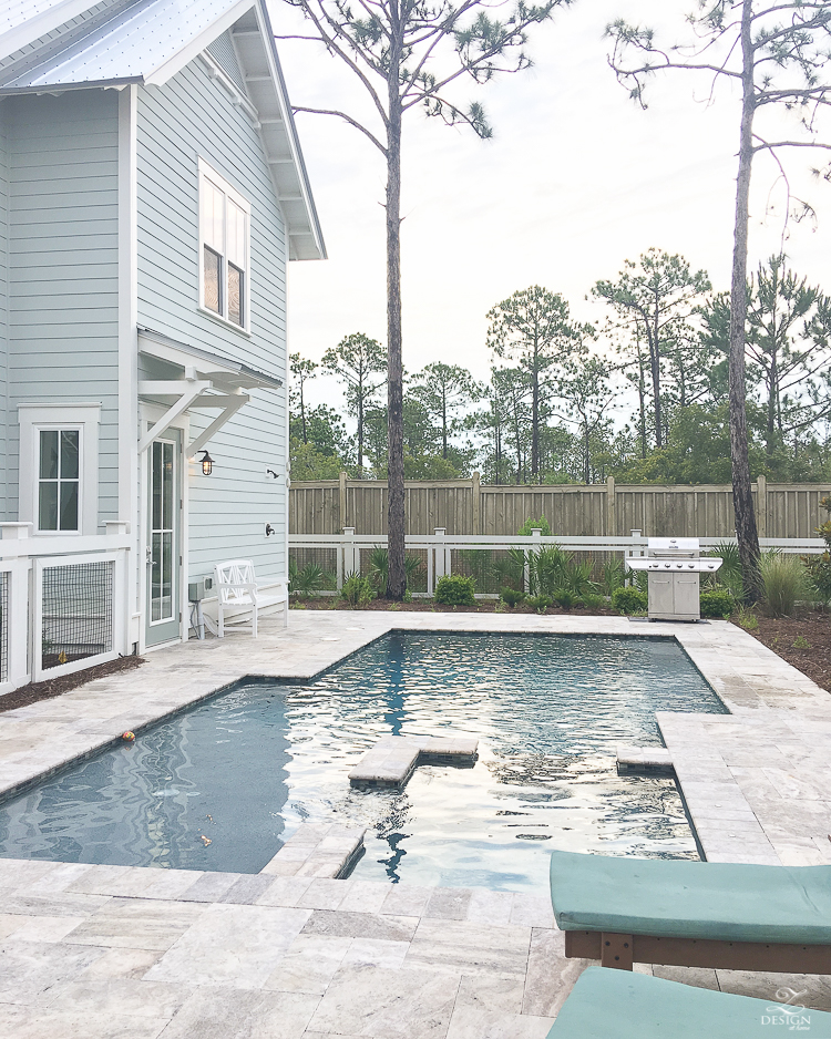 medium size modern pool with shallow end and hot tub area