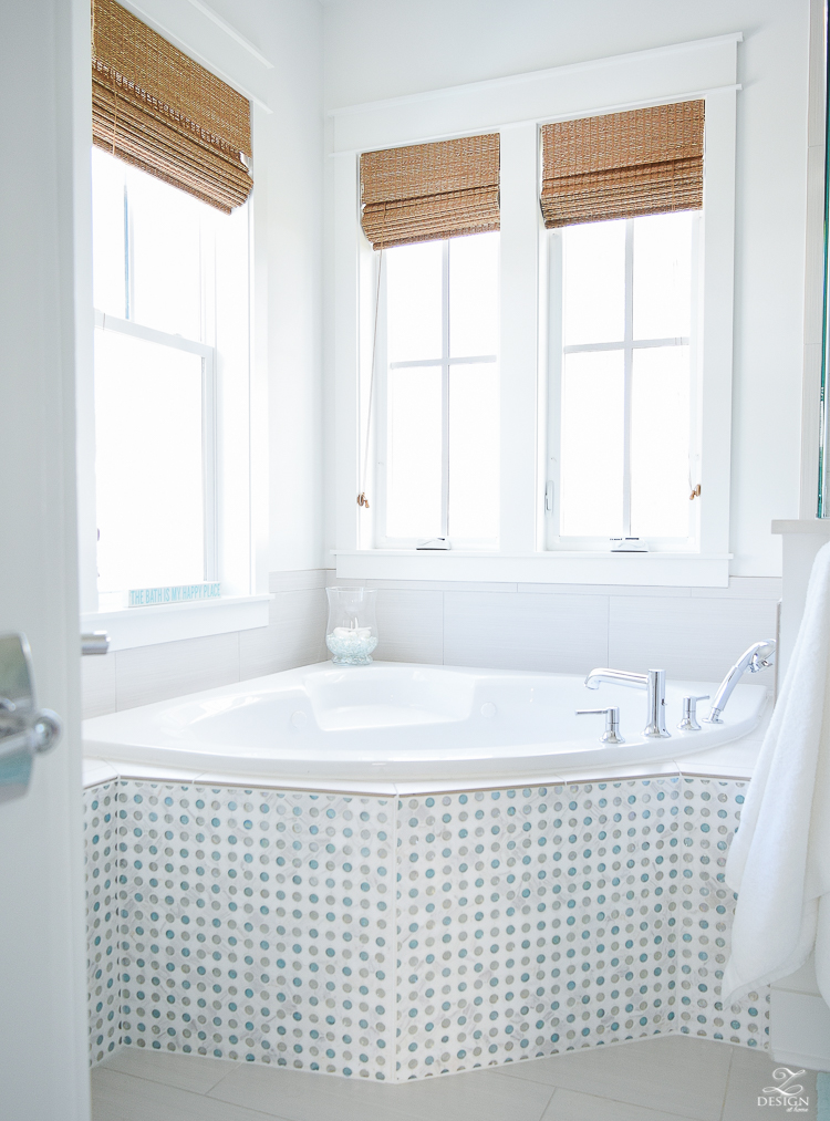 bathtub area in a coastal cottage home soaking tub in a beach house