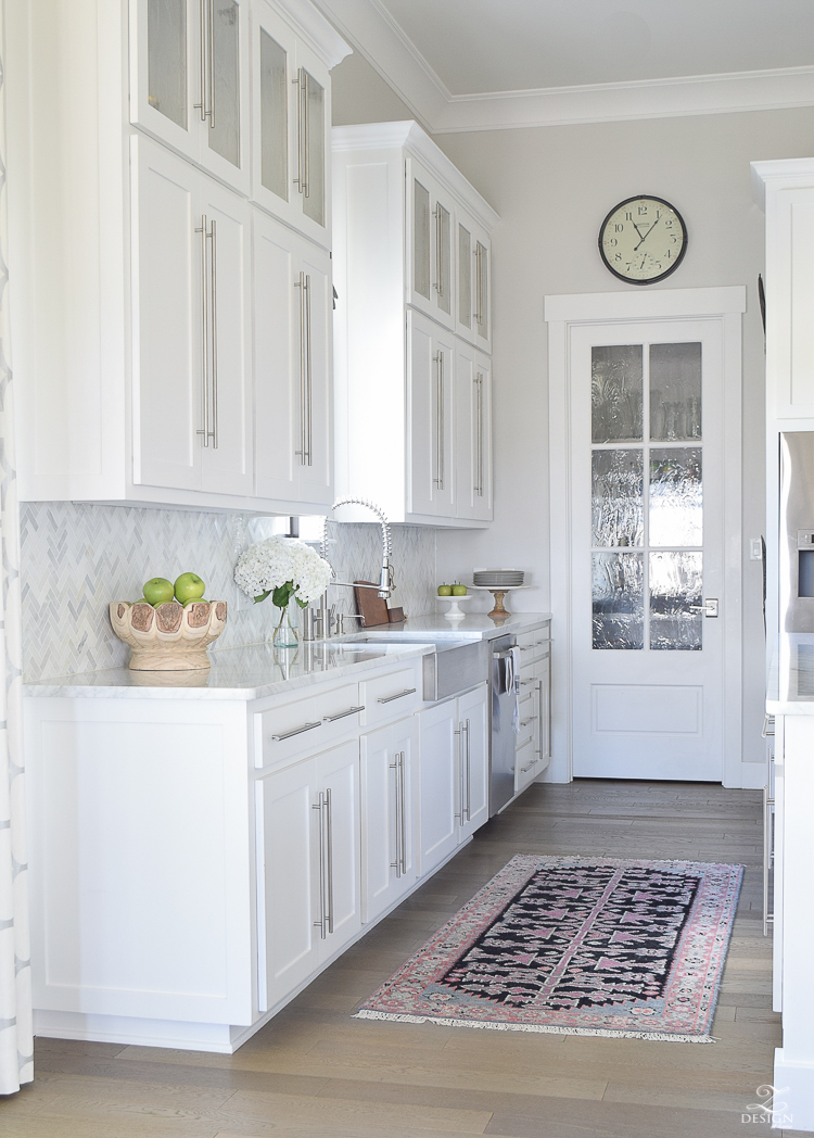 10 simple tips for styling the kitchen counters white modern farmhouse kitchen white shaker cabinets white carrar marble marble counters and herringbone backsplash kitchen countertop decor-1