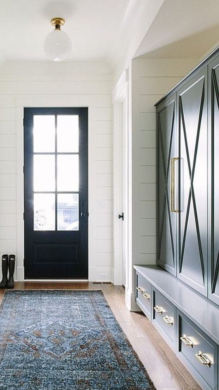 mud room lockers painted green with brass hardware