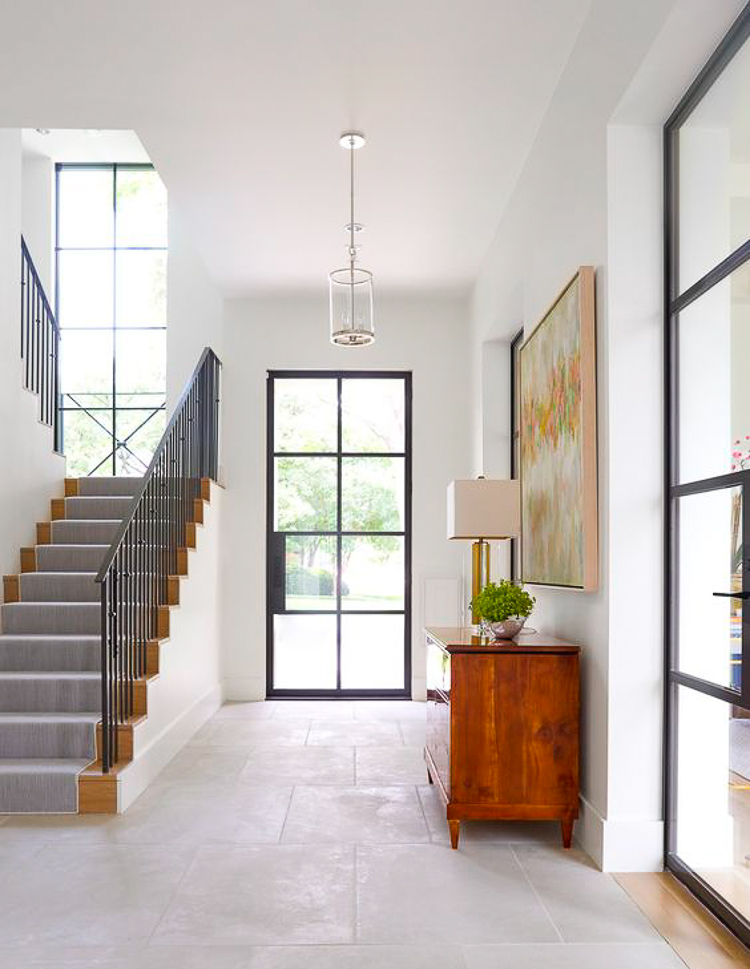 Custom Home Build Journey Inspiration Building a custom home in houston, texas image of steel door in entry way window in staircase 