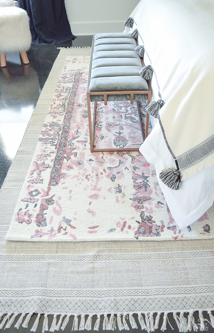 Romantic bedroom with Vintage inspired blush and gray rug plus tips for layering your rugs