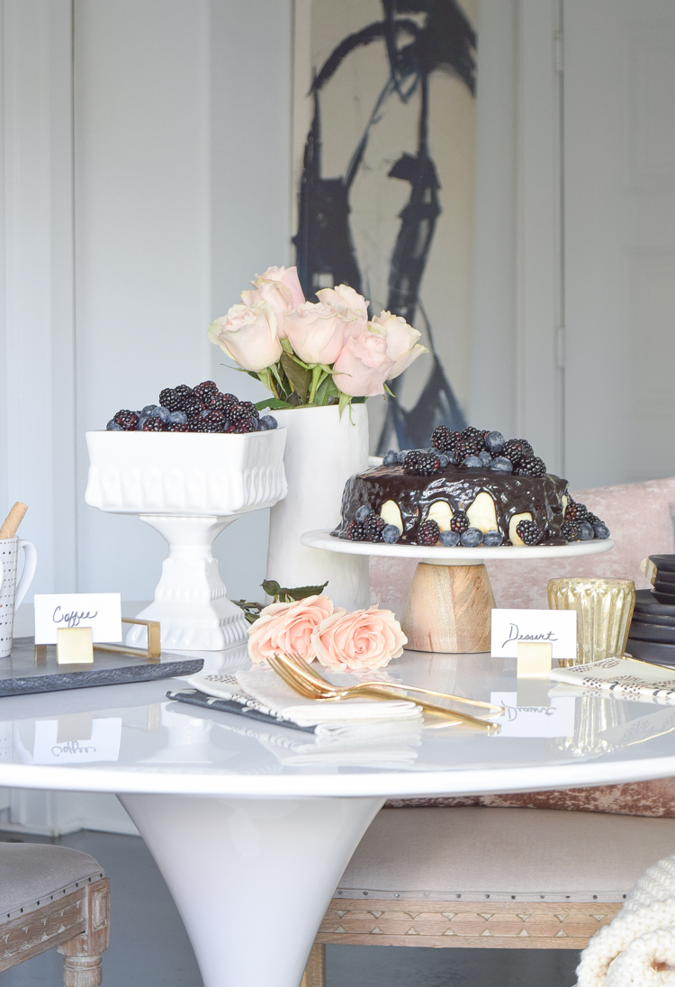 How to dress up a store bough cake for stress free holiday hosting - white cake with chocolate drizzle and berries 