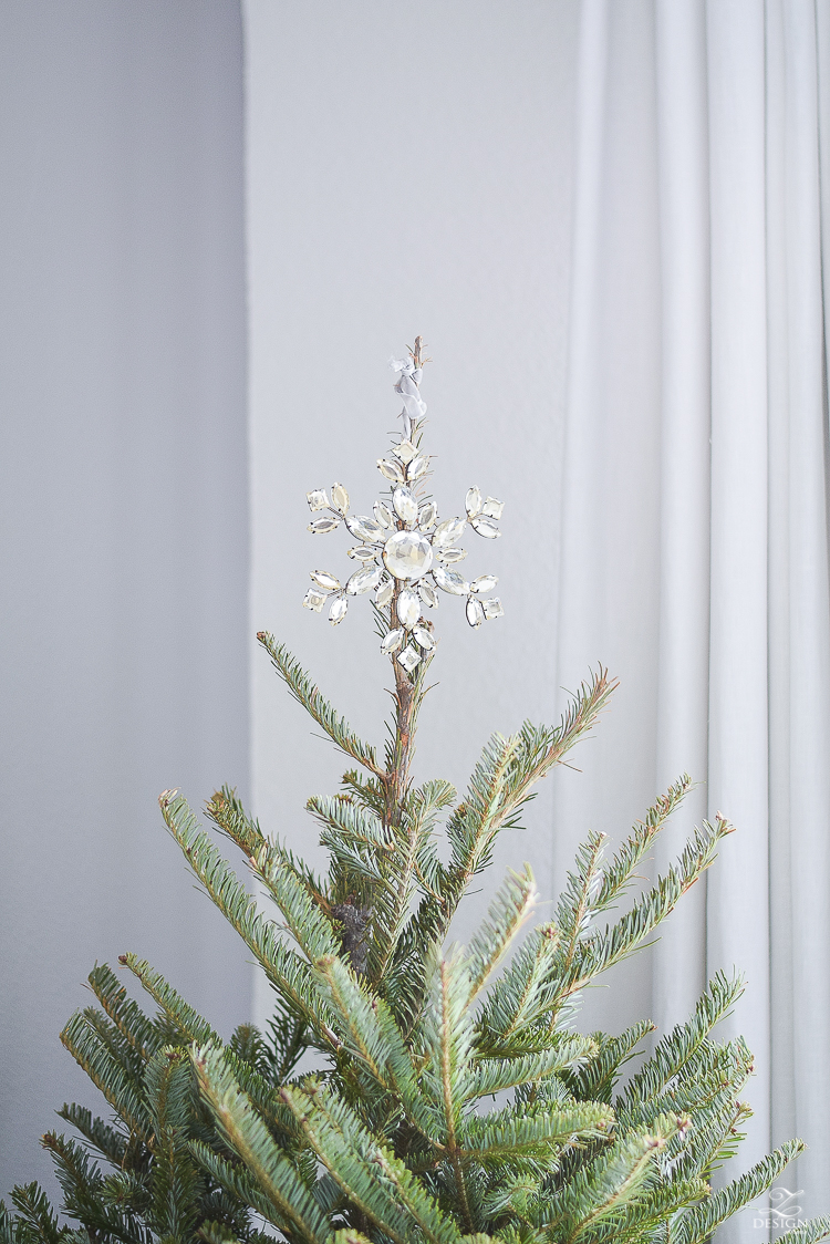 Crystal ornament used as tree topper on a real christmas tree 