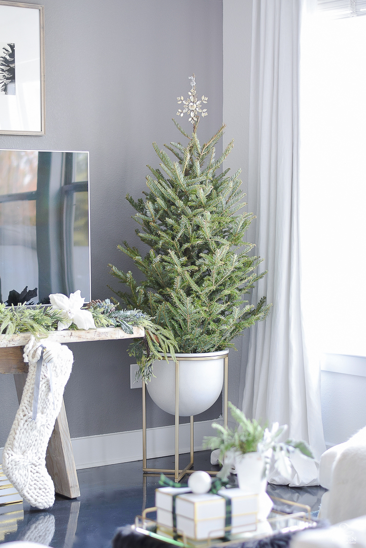 Christmas tree in modern pot with brass legs - Boho glam christmas living room tour