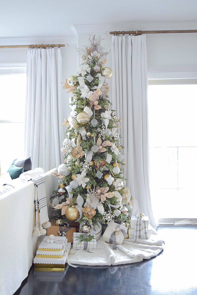 White and gold glam christmas tree in a boho chic Christmas living room tour