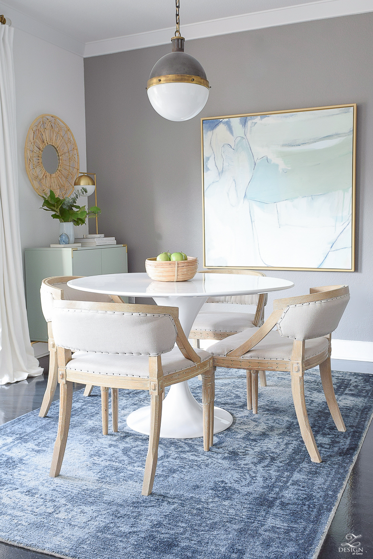 Boho chic dining space with navy distressed rug, whitman pendant and the best knock off tulip table