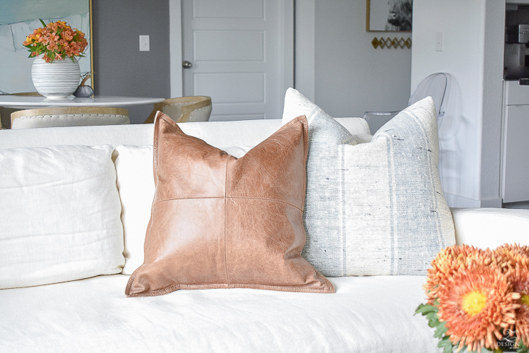 Simple modern fall decorating ideas - leather and grain sack pillows