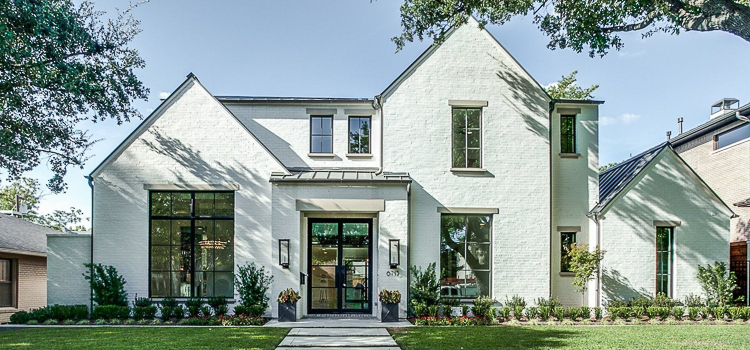 LRO Residential - Transitiona Modern Home with White Brick, black windows and steel doors