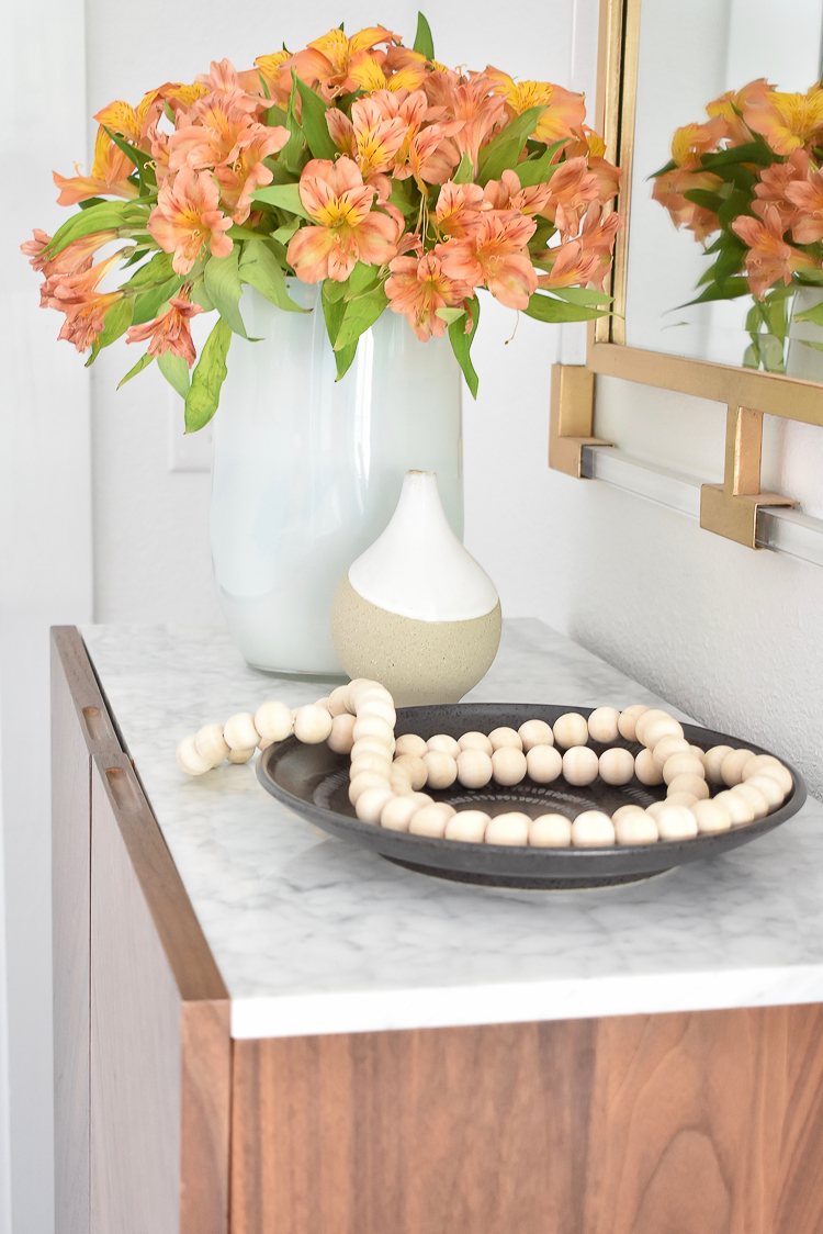 Small Transitional Entryway That Packs A Big Punch - Lucite and Gold Mirror