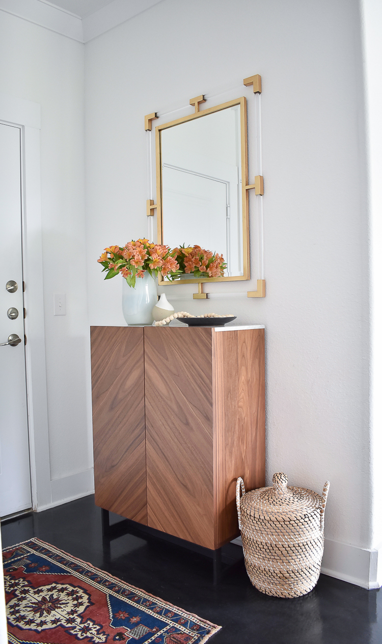 Small Transitional Entry That Packs A Big Punch - How to organize a small entry way, shallow entryway cabinet w/ marble top, brass/gold lucite mirror