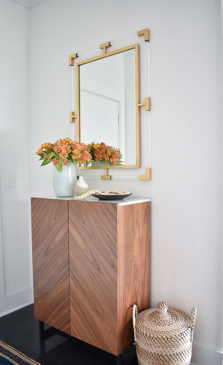 Small Transitional Entry That Packs A Big Punch - Modern entry cabinet with marble top, lucite & gold mirror