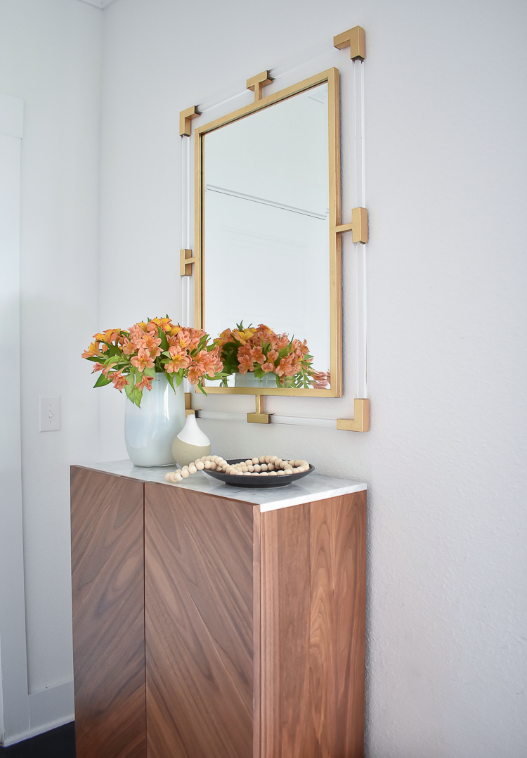 Small Transitional Entryway That Packs A Big Punch - Lucite and Gold Mirror