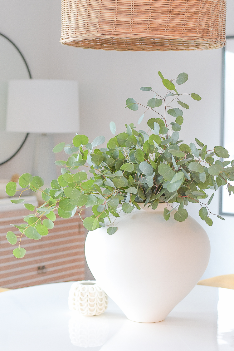 Boho chic dining room reveal - large white vase with eucalyptus / table centerpiece