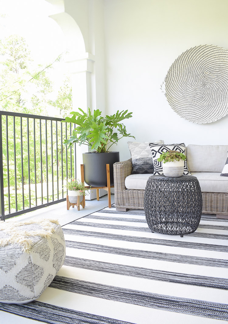 Tips For Creating A Relaxing Outdoor Space This Summer + A Patio Tour - black and white themed porch