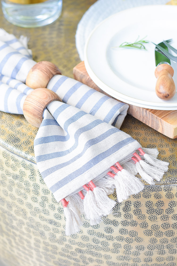 Sustainably sourced tassel striped napkins, olive wood napkin rings