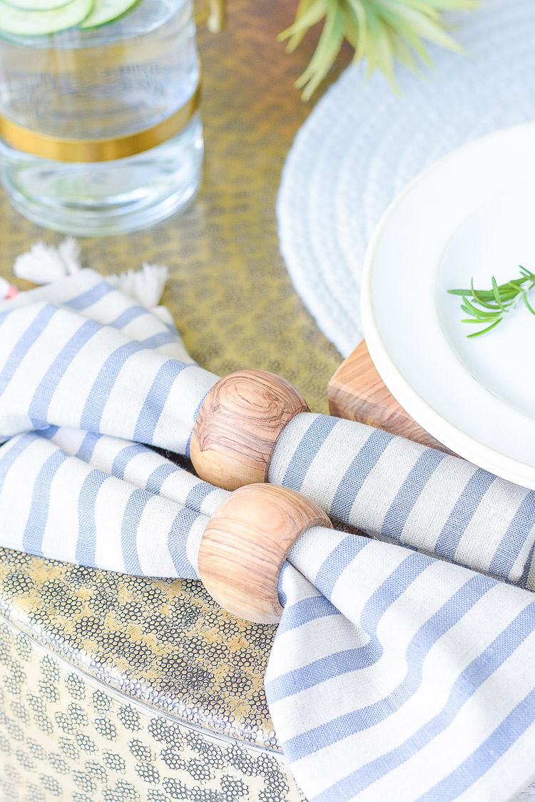 Sustainably sourced tassel striped napkins, olive wood napkin rings