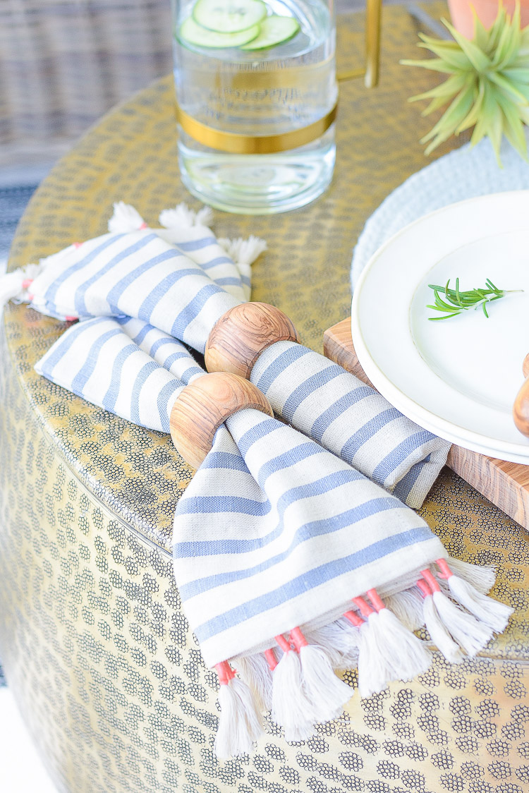 Sustainably sourced tassel striped napkins, olive wood napkin rings