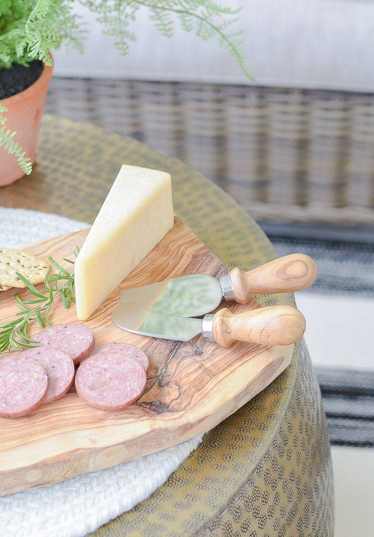 Sustainably sources olive wood cheese board and knives