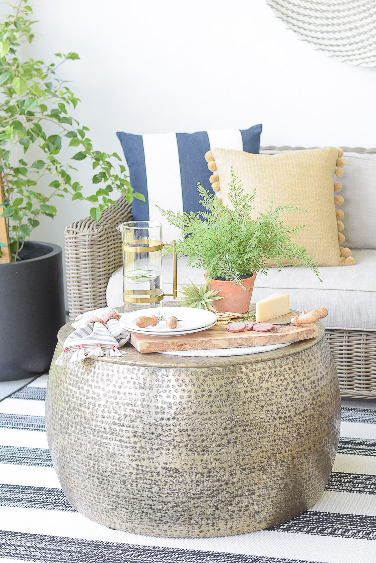 Sustainably sourced outdoor coffee table, dining accessories, pillows