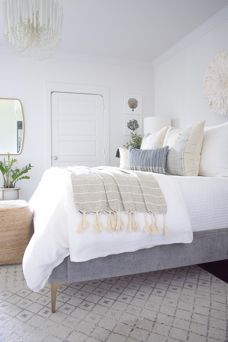 4 Subtle Ways To Add Coastal Decor To Your Home - Coastal Inspired Bedroom in blue and white