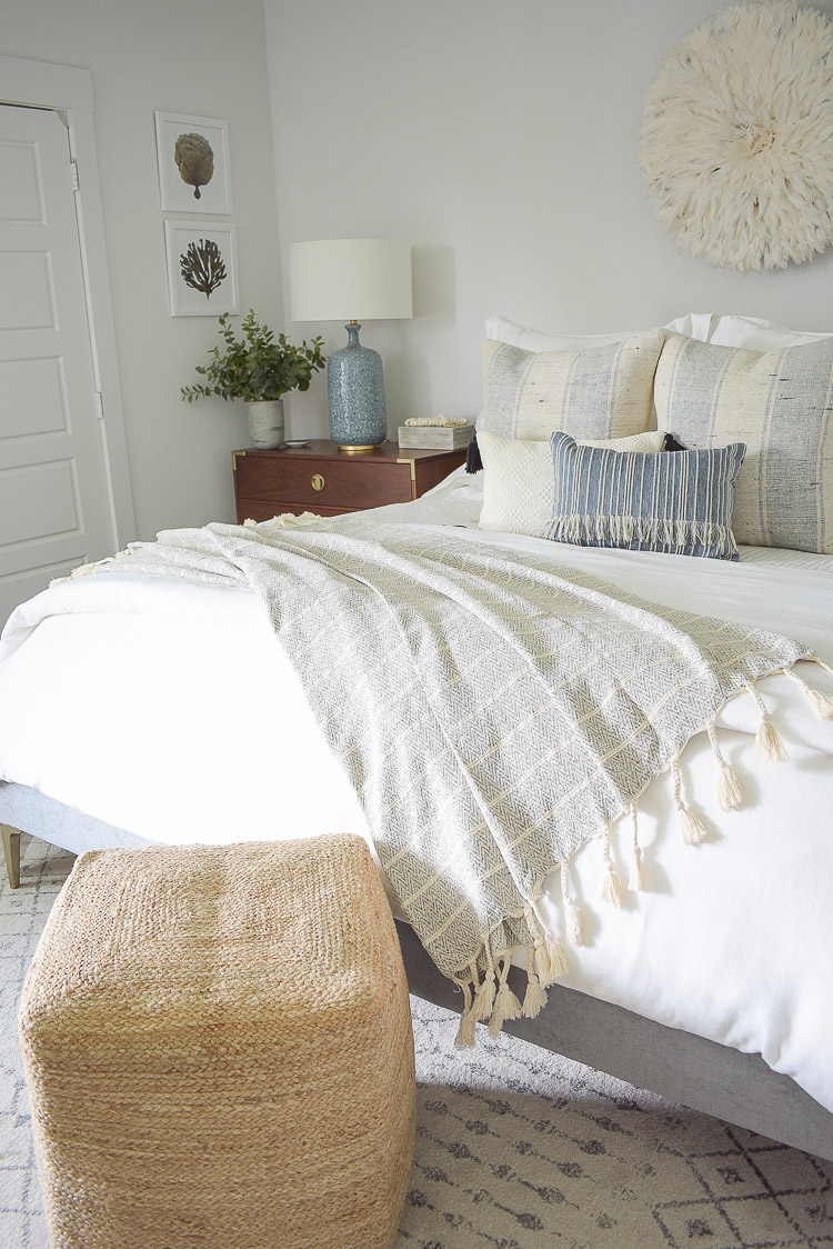 4 Subtle Ways To Add Coastal Decor To Your Home - Coastal Inspired Bedroom - neutral tassel throw in coastal inspired bedroom