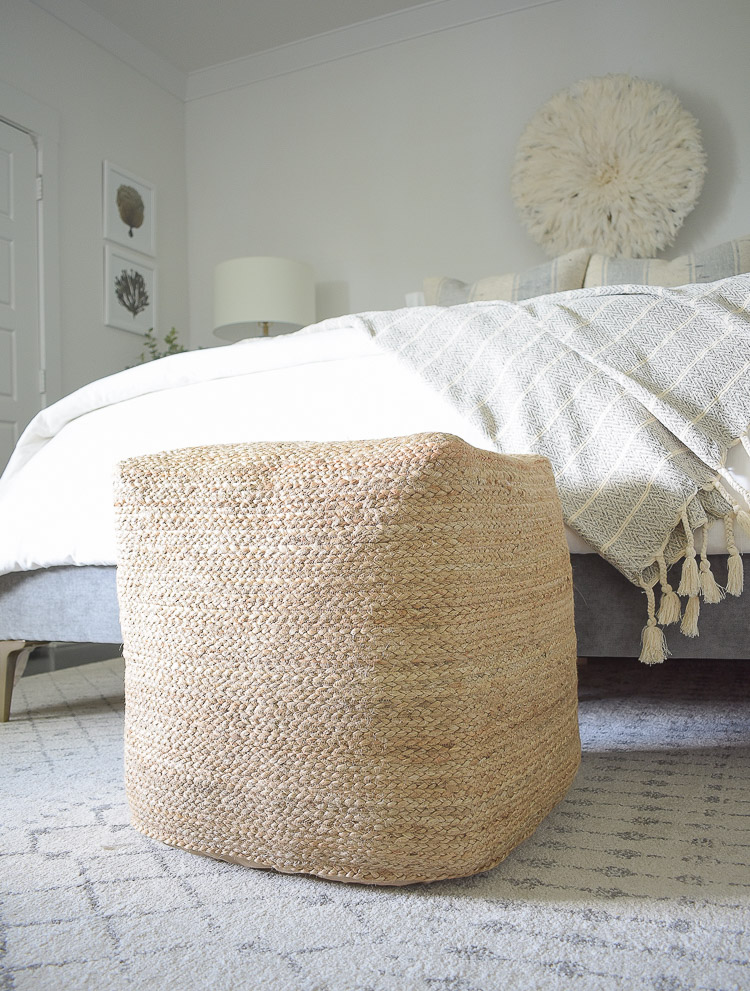 4 Subtle Ways To Add Coastal Decor To Your Home - Coastal Inspired Bedroom - square jute pouf