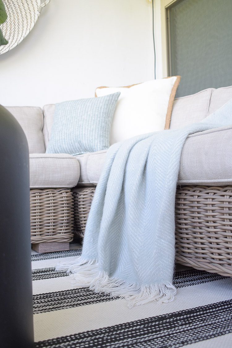 A Cozy Modern Fall Patio Tour - soft herringbone throw in gray 