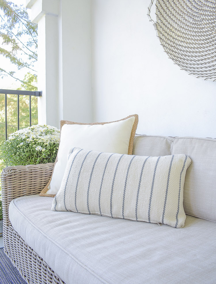 A Cozy Modern Fall Patio Tour - boho chic indoor outdoor pillow with texture 