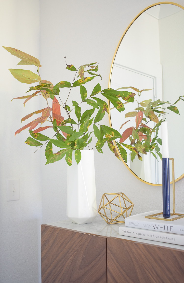 Chic Modern Styled Fall Entry - white geometric vase with fall outdoor clippings/branches