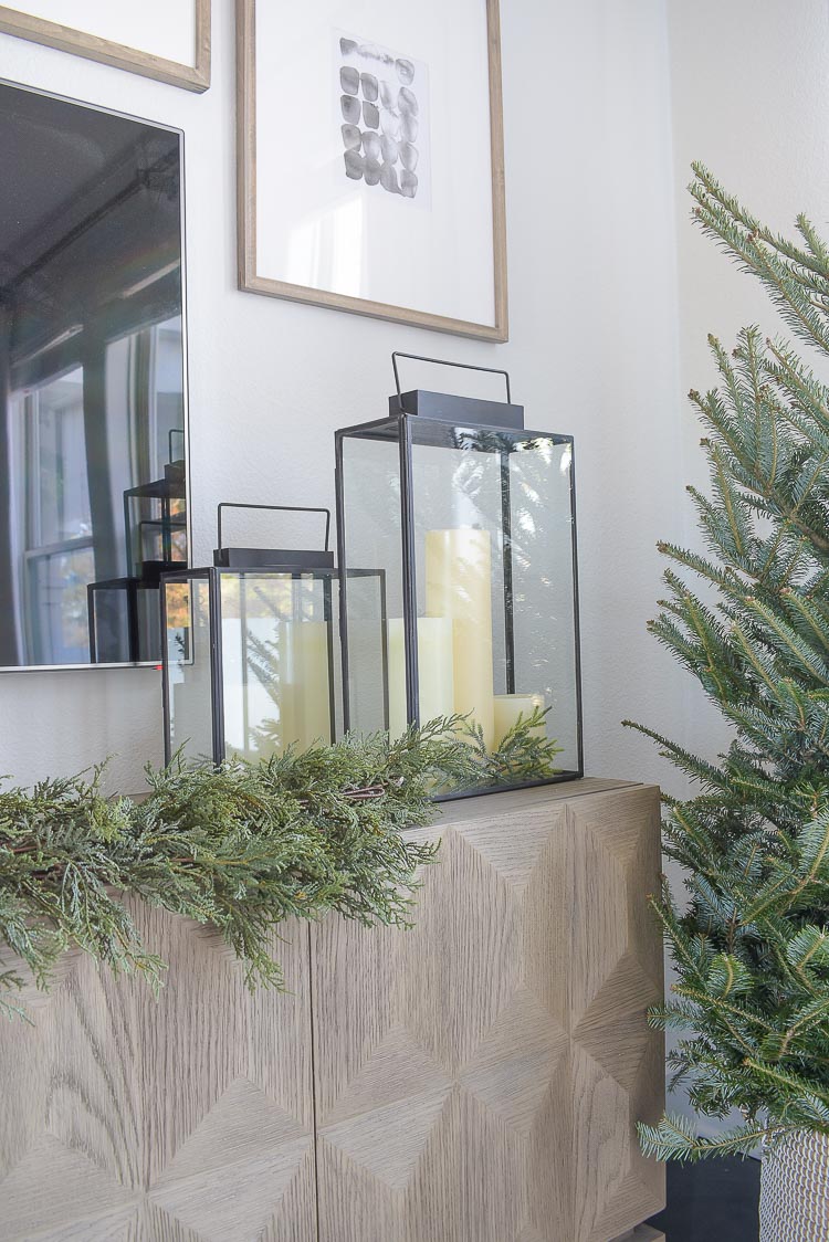 Black, white & gold modern Christmas living room tour - LED candles in modern black lanterns