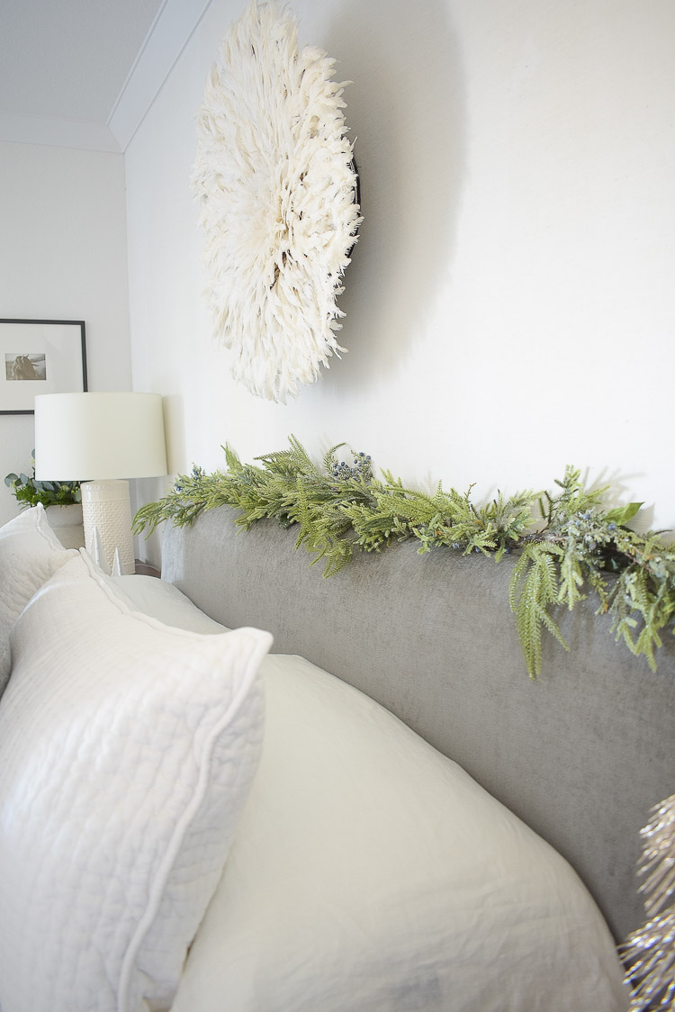 Holiday Bedroom Tour - christmas garland on headboard 