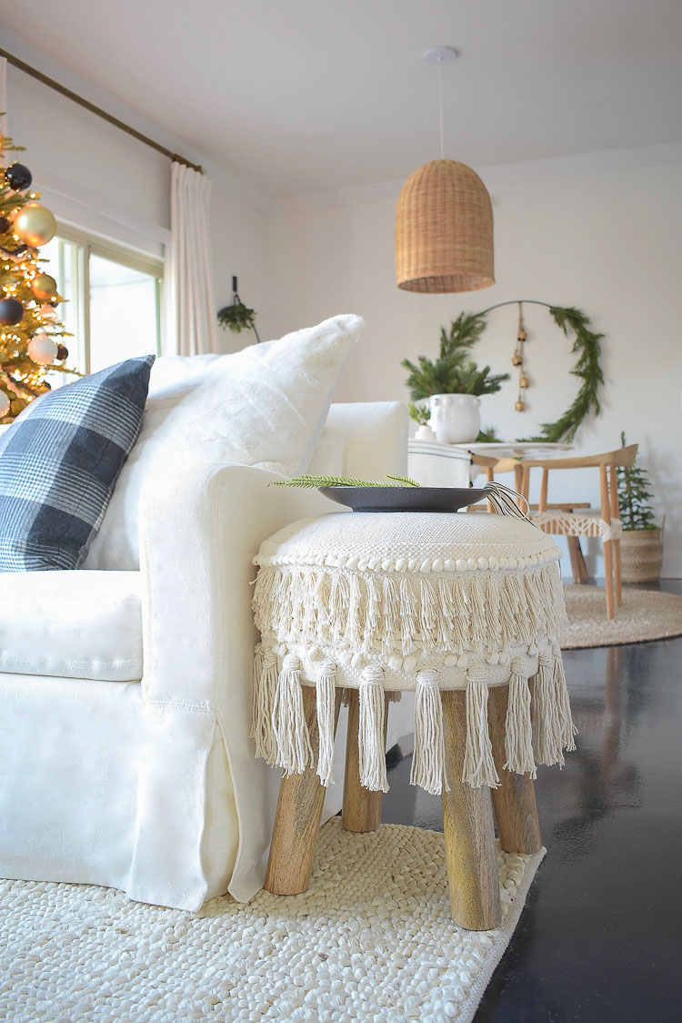 Black, white & gold modern Christmas living room tour - fringe hassle stool / ottoman