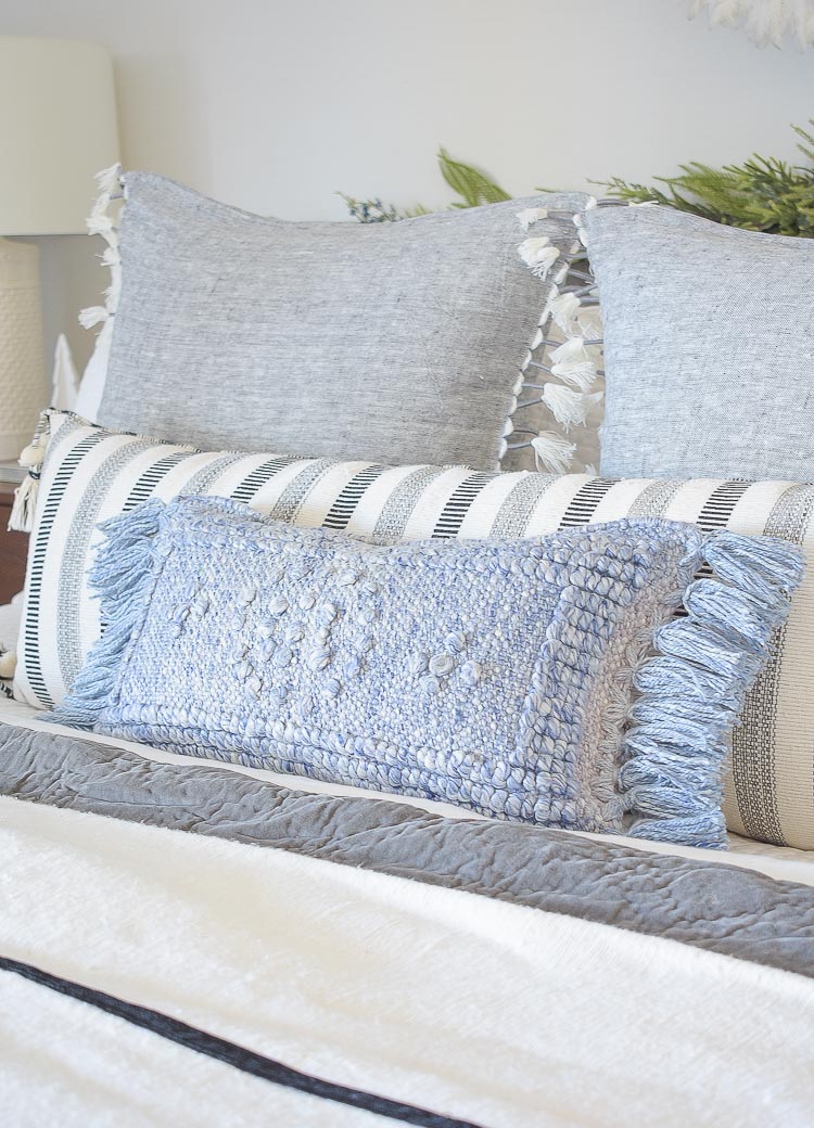 Holiday Bedroom Tour - blue textured indoor outdoor pillow with fringe 