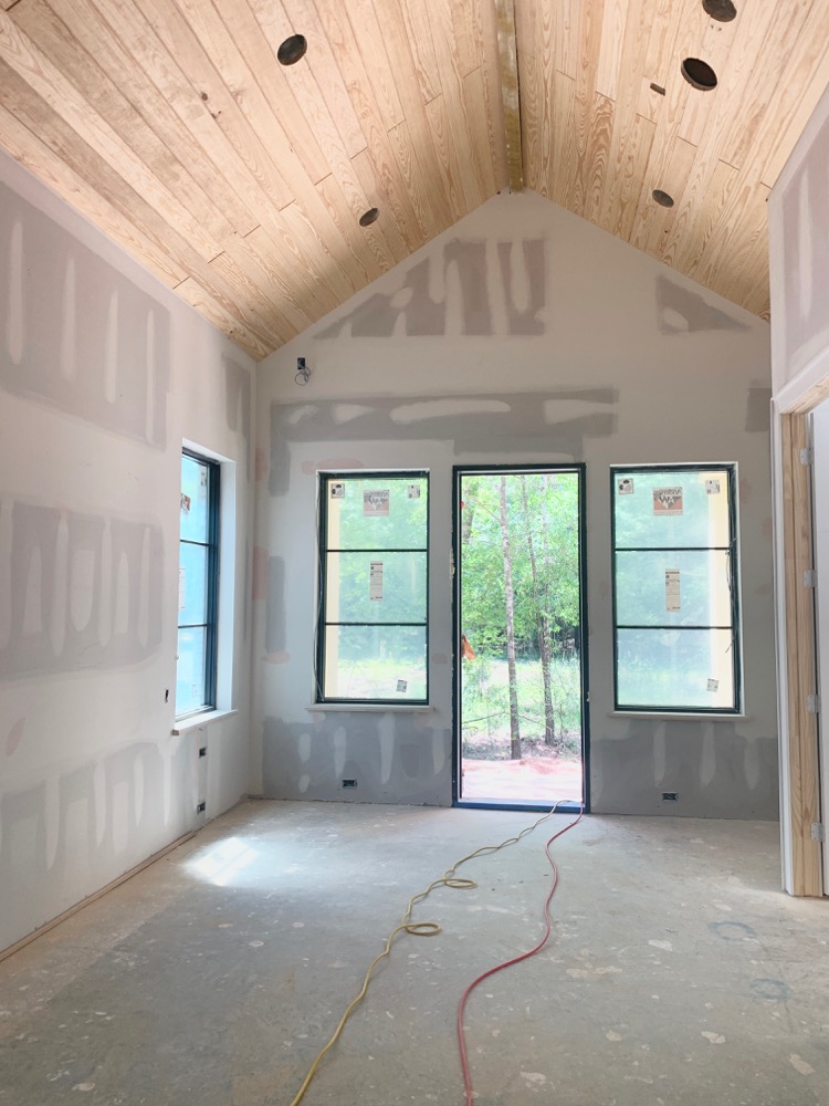 Transitional Modern Master Bedroom Under Construction with V-Groove Ceiling and horizontal grid modern windows by Andersen 