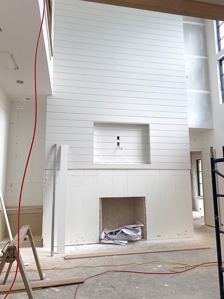 White shiplap fireplace - modern farmhouse under construction 