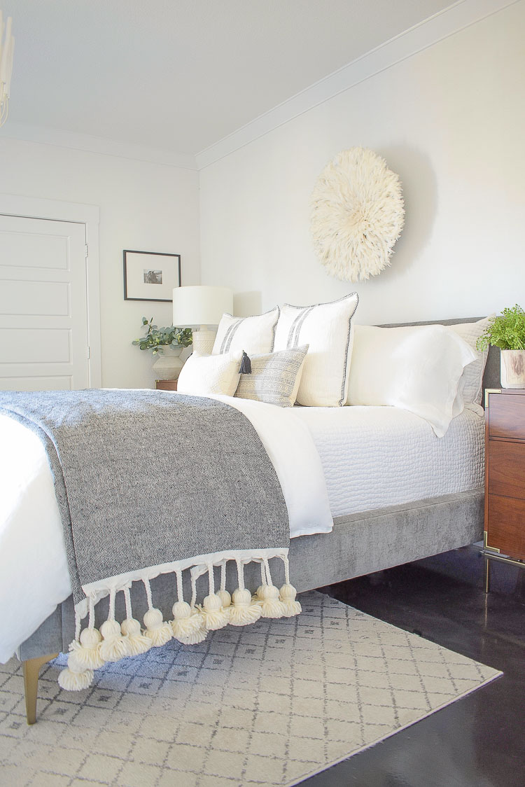 black and white sprig bedroom tour - juju hat and large tassel throw 