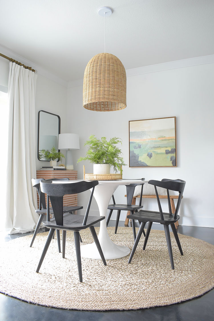 Black dining chairs in boho chic dining room tour