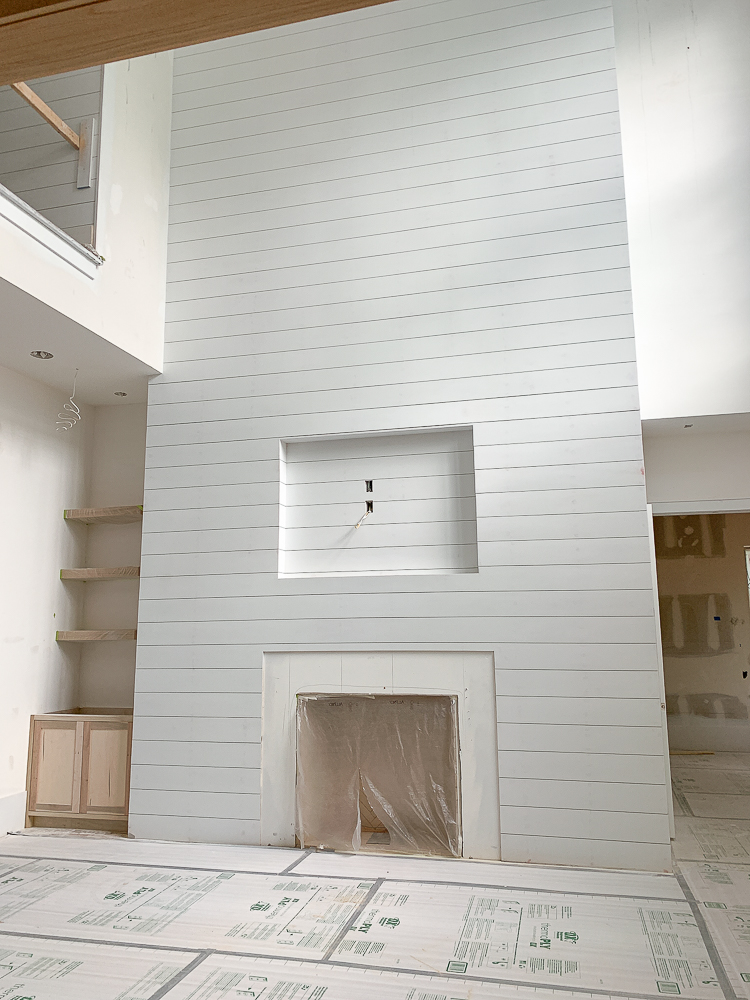 white shiplap fireplace wall