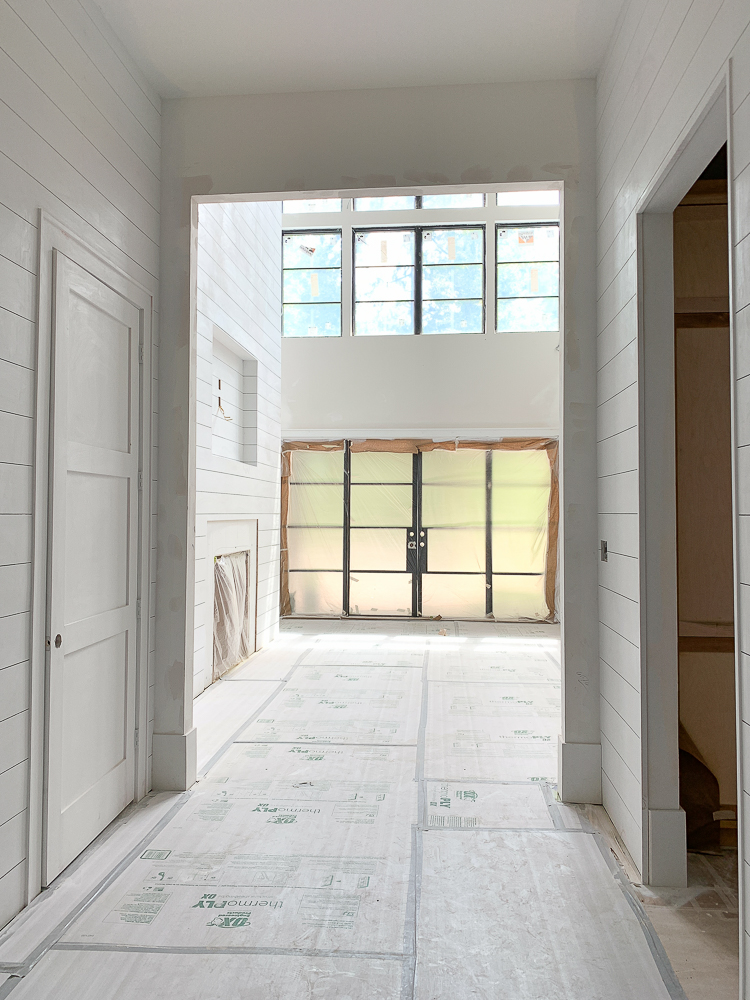 Modern farmhouse shiplap walls and fireplace, steel doors