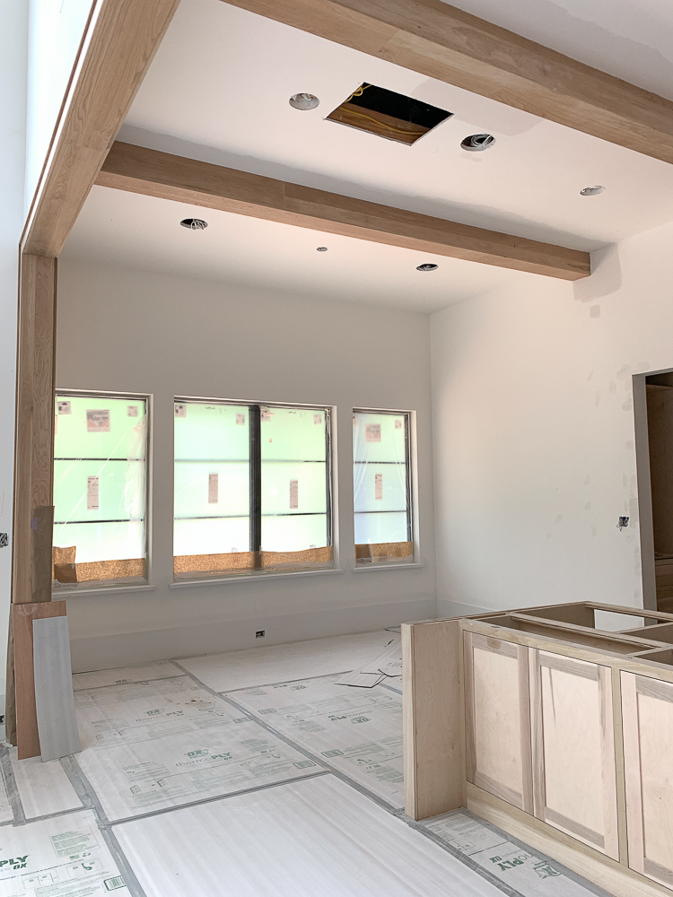 dining room off kitchen with white oak box beams