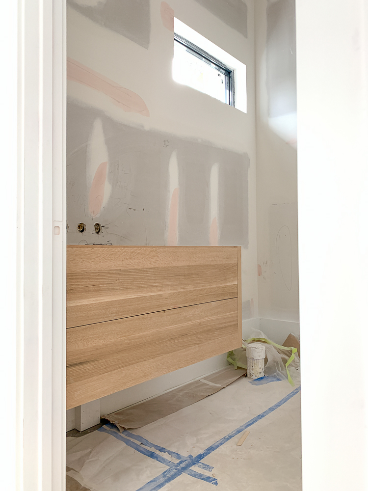 white oak floating vanity with flat drawers