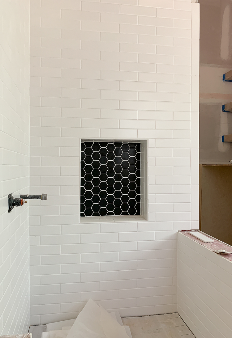 white subway tile black hex tile in dog wash