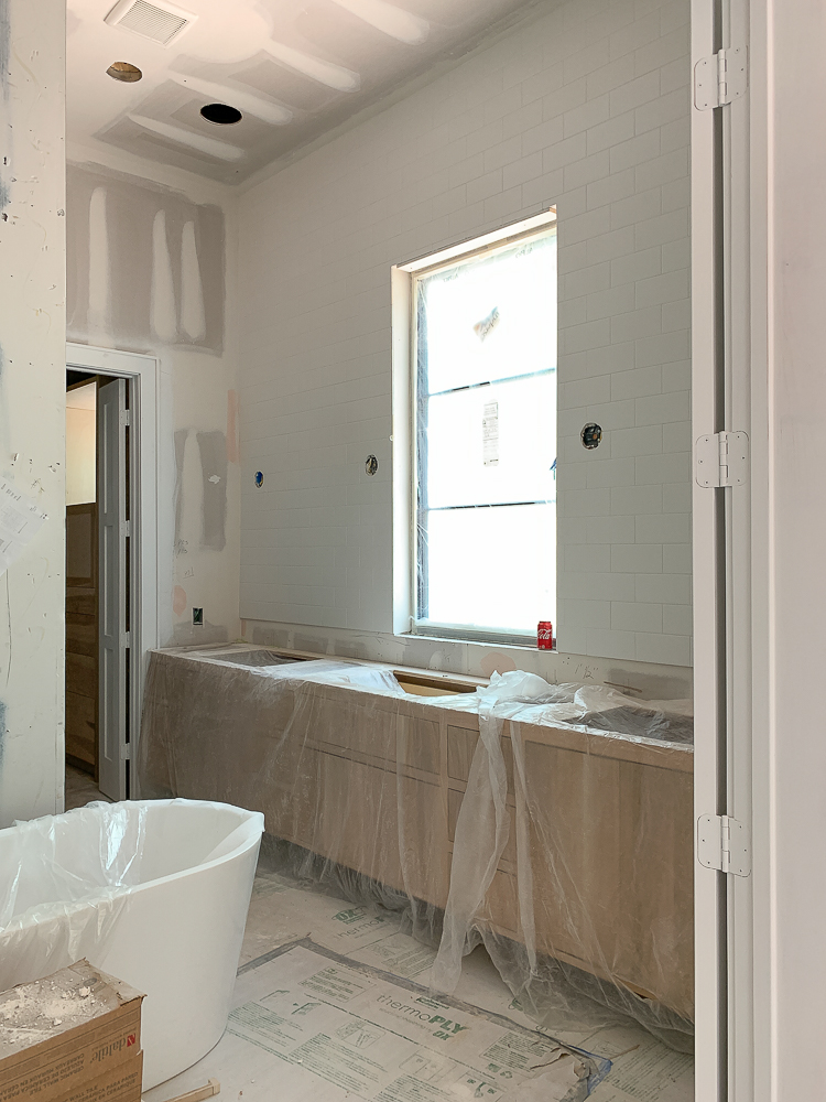 master bath white oak vanity modern farmhouse under construction 