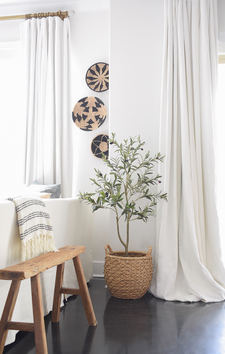 Faux olive tree in hyacinth basket with handles 