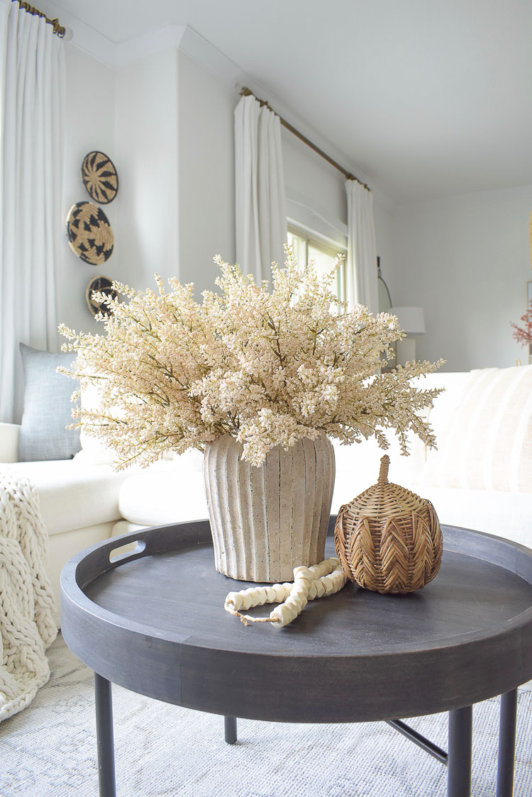 Fall coffee table decor, rattan pumpkin, bone beads, fall arrangement